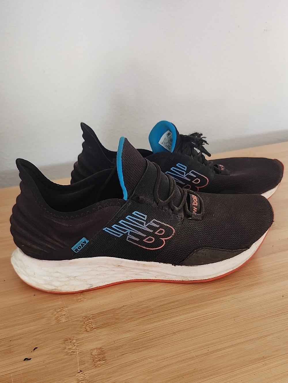 New Balance Black Athletic Running Shoes with Blue Accents